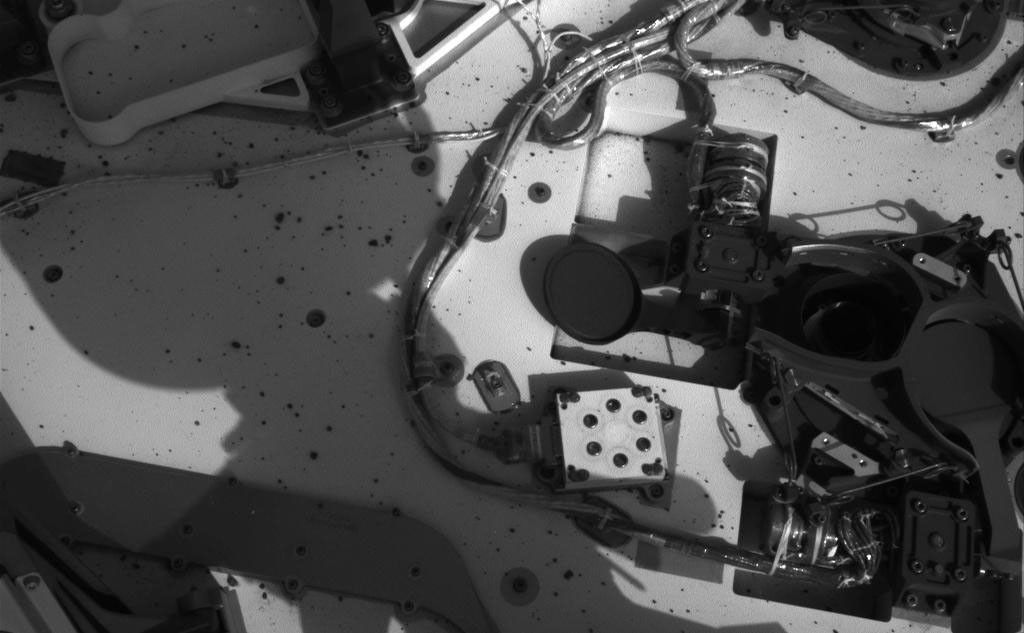 This set of images from NASA's Curiosity rover shows the inlet covers for the Sample Analysis at Mars instrument opening and closing, as the rover continues to check out its instruments in the first phase after landing.