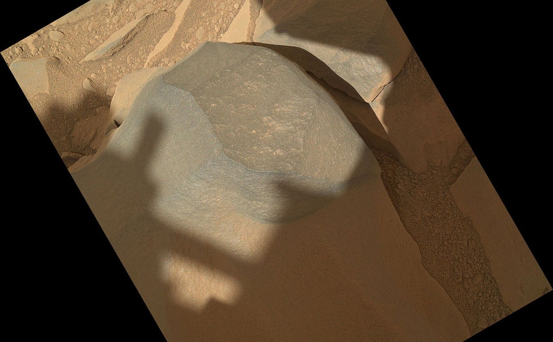 NASA's Mars rover Curiosity held its Mars Hand Lens Imager (MAHLI) camera about 10.5 inches (27 centimeters) away from the top of a rock called "Bathurst Inlet" for a set of eight images combined into this merged-focus view of the rock.