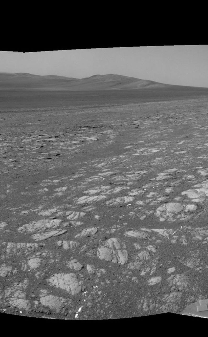 On the horizon in the right half of this panoramic view is an area of Mars informally named "Matijevic Hill," in commemoration of an influential rover-team leader.