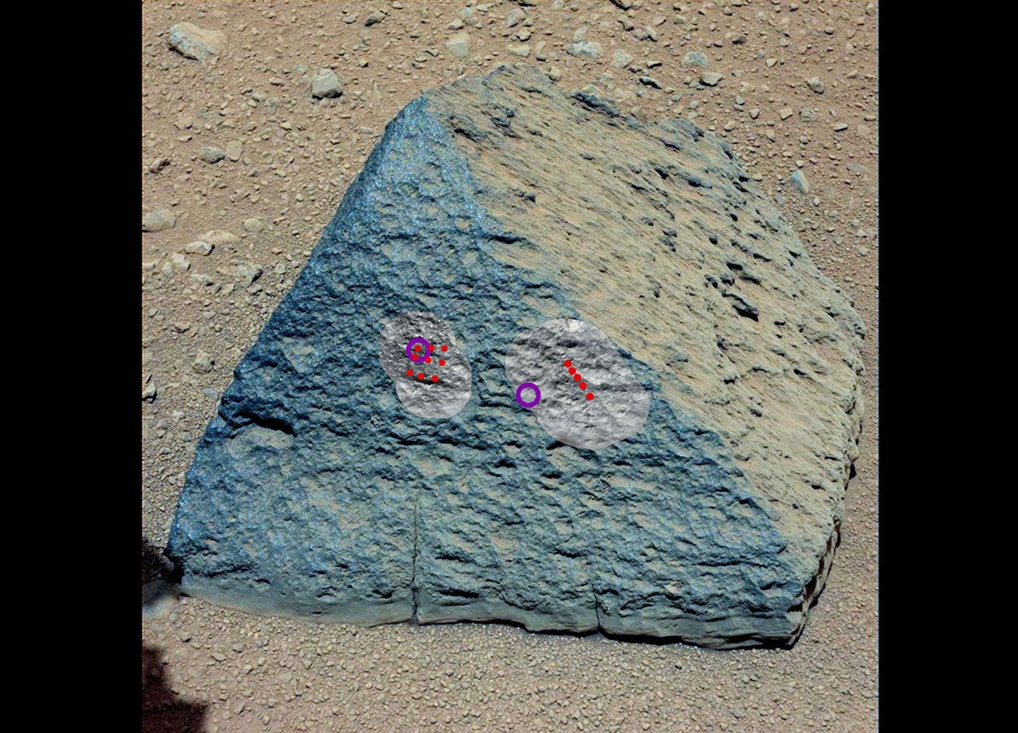 This image shows where NASA's Curiosity rover aimed two different instruments to study a pyramid-shaped rock known as "Jake Matijevic."