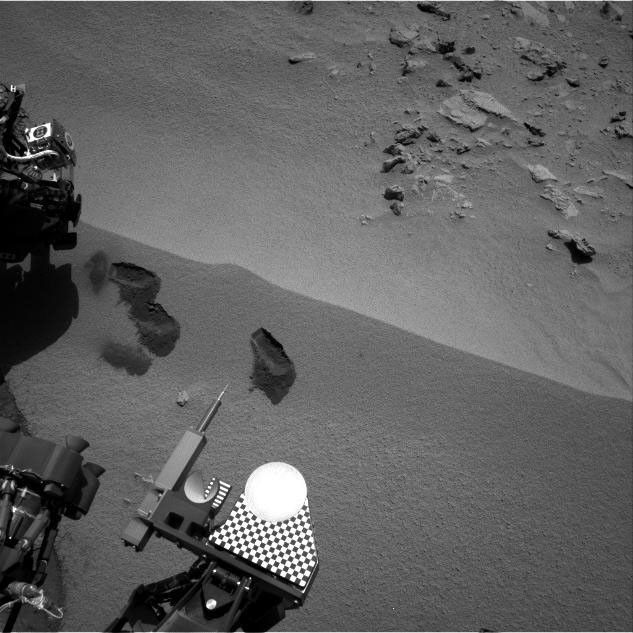 Three bite marks left in the Martian ground by the scoop on the robotic arm of NASA's Mars rover Curiosity are visible in this image taken by the rover's right Navigation Camera during the mission's 69th Martian day, or sol (Oct. 15, 2012).