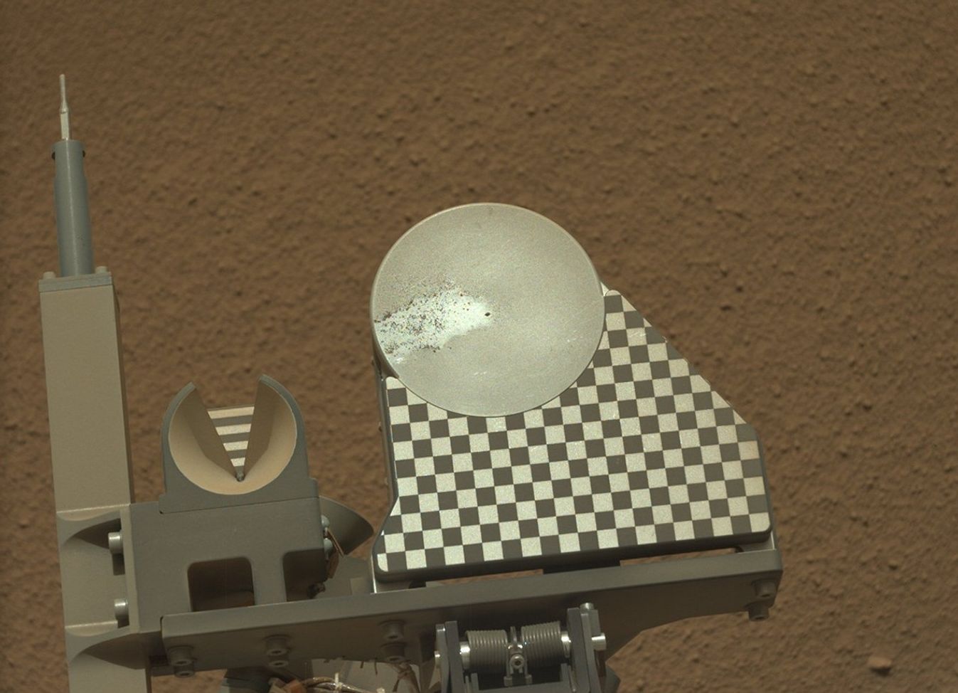 The robotic arm on NASA's Mars rover Curiosity delivered a sample of Martian soil to the rover's observation tray for the first time during the mission's 70th Martian day, or sol (Oct. 16, 2012)