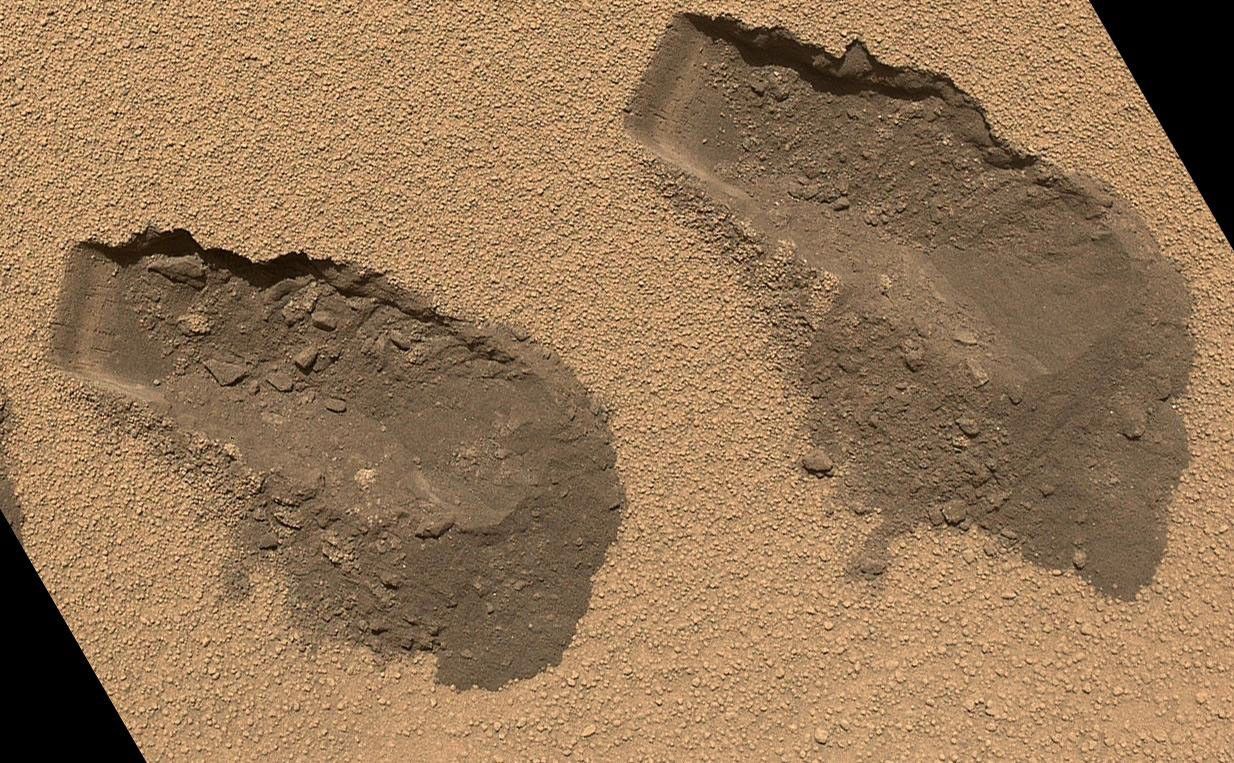 This is a view of the third (left) and fourth (right) trenches made by the 1.6-inch-wide (4-centimeter-wide) scoop on NASA's Mars rover Curiosity in October 2012.