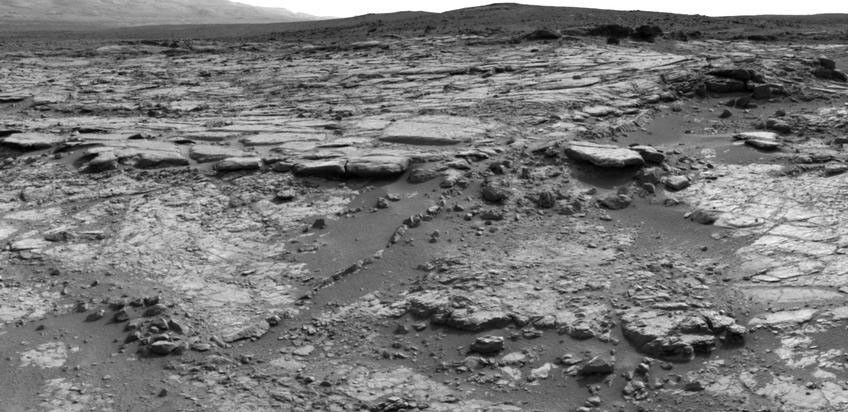 The sinuous rock feature in the lower center of this mosaic of images recorded by the NASA Mars rover Curiosity is called "Snake River."