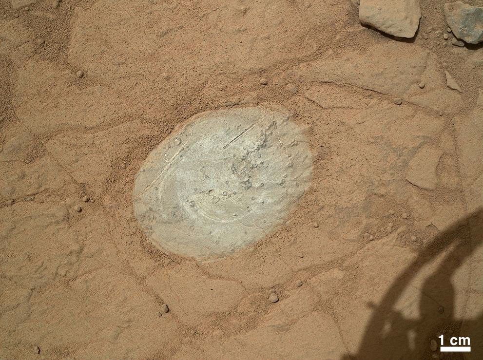 This image from the Mars Hand Lens Imager (MAHLI) on NASA's Mars rover Curiosity shows the patch of rock cleaned by the first use of the rover's Dust Removal Tool (DRT).