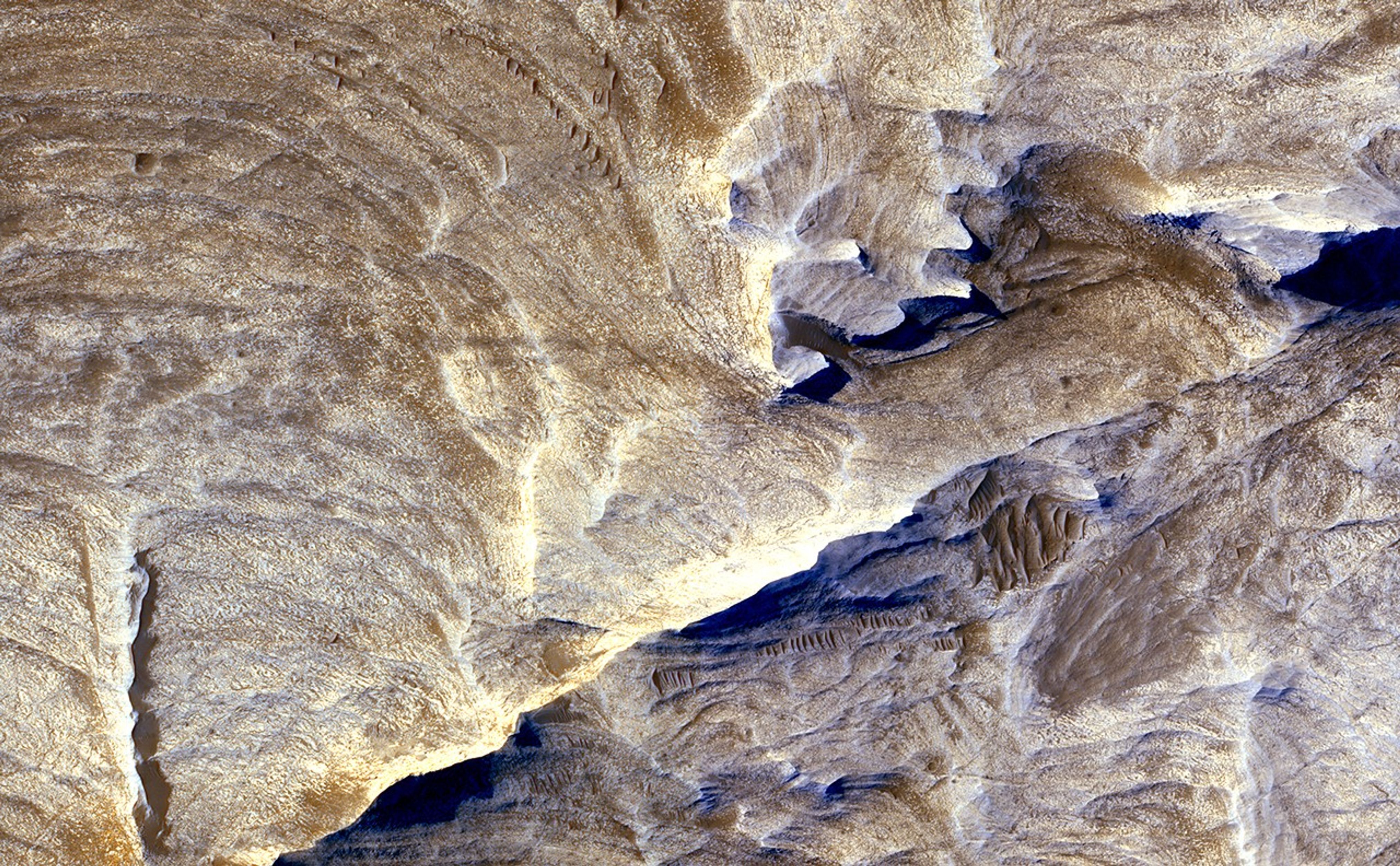 The image was acquired during winter in Mars' southern hemisphere. It combines separate band passes taken by the High Resolution Imaging Science Experiment in blue-green light, red light and near-infrared light.
