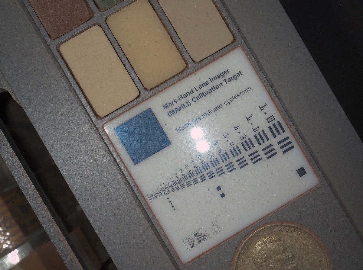 This image of a calibration target illuminated by white-light LEDs (light emitting diodes) is part of the first set of nighttime images taken by the Mars Hand Lens Imager (MAHLI) camera at the end of the robotic arm of NASA's Mars rover Curiosity.