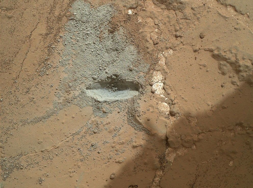 The bit in the rotary-percussion drill of NASA's Mars rover Curiosity left its mark in a target patch of rock called "John Klein" during a test on the rover's 176th Martian day, or sol (Feb. 2, 2013), in preparation for the first drilling of a rock by the rover.