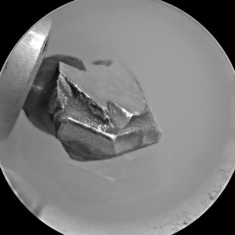 The shape of the tip of the bit in the drill of NASA's Mars rover Curiosity is apparent in this view recorded by the remote micro-imager in the rover's Chemistry and Camera instrument during the 172nd Martian day, or sol, of Curiosity's work on Mars (Jan. 29, 2012).