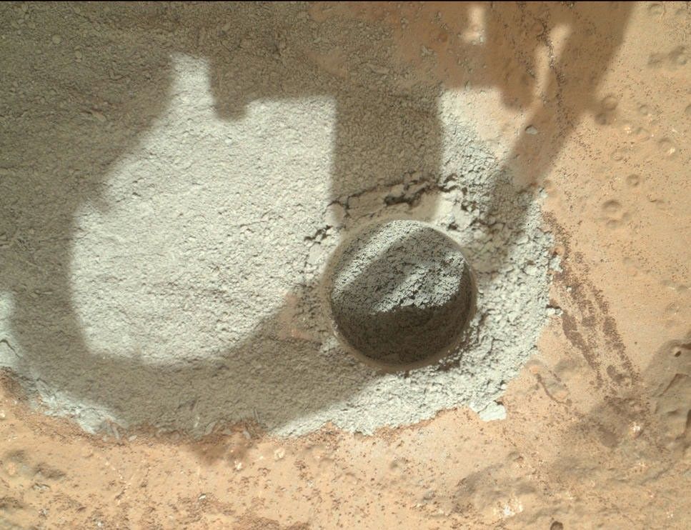 In an activity called the "mini drill test," NASA's Mars rover Curiosity used its drill to generate this ring of powdered rock for inspection in advance of the rover's first full drilling.
