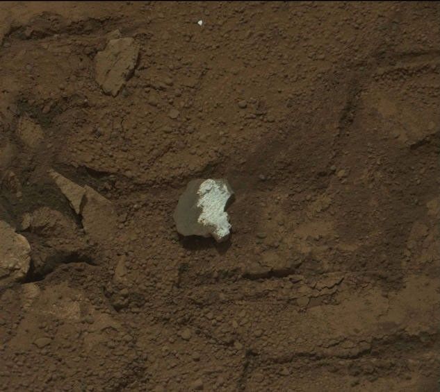 This raw image of "Tintina," a broken rock fragment in a rover wheel track, was taken by Curiosity's Mast Camera (Mastcam).