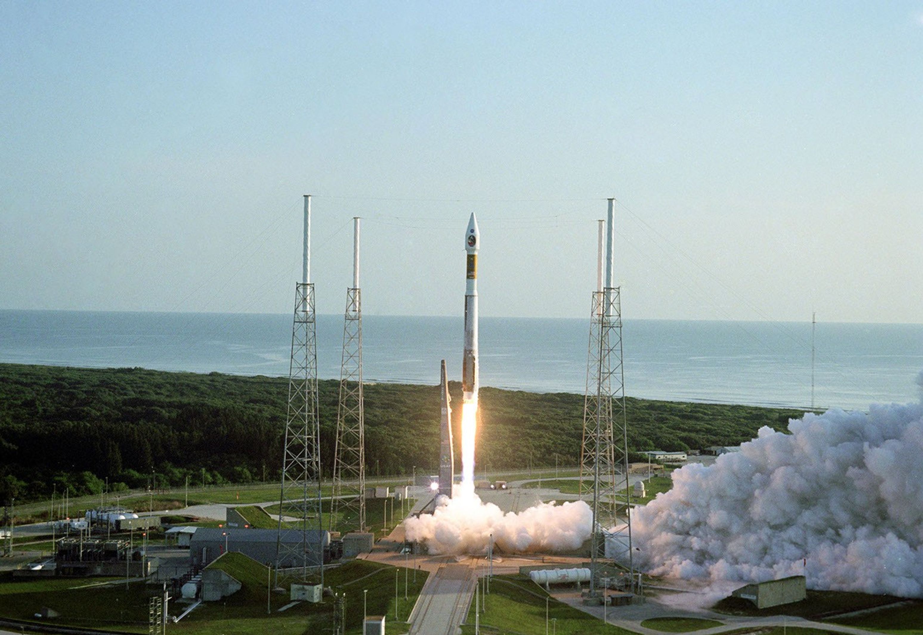 With the Atlantic Ocean as a backdrop, an Atlas V launch vehicle, 19 stories tall, with a two-ton Mars Reconnaissance Orbiter on top, roars away from Launch Complex 41 at Cape Canaveral Air Force Station at 7:43 a.m. EDT on Aug. 12, 2005.