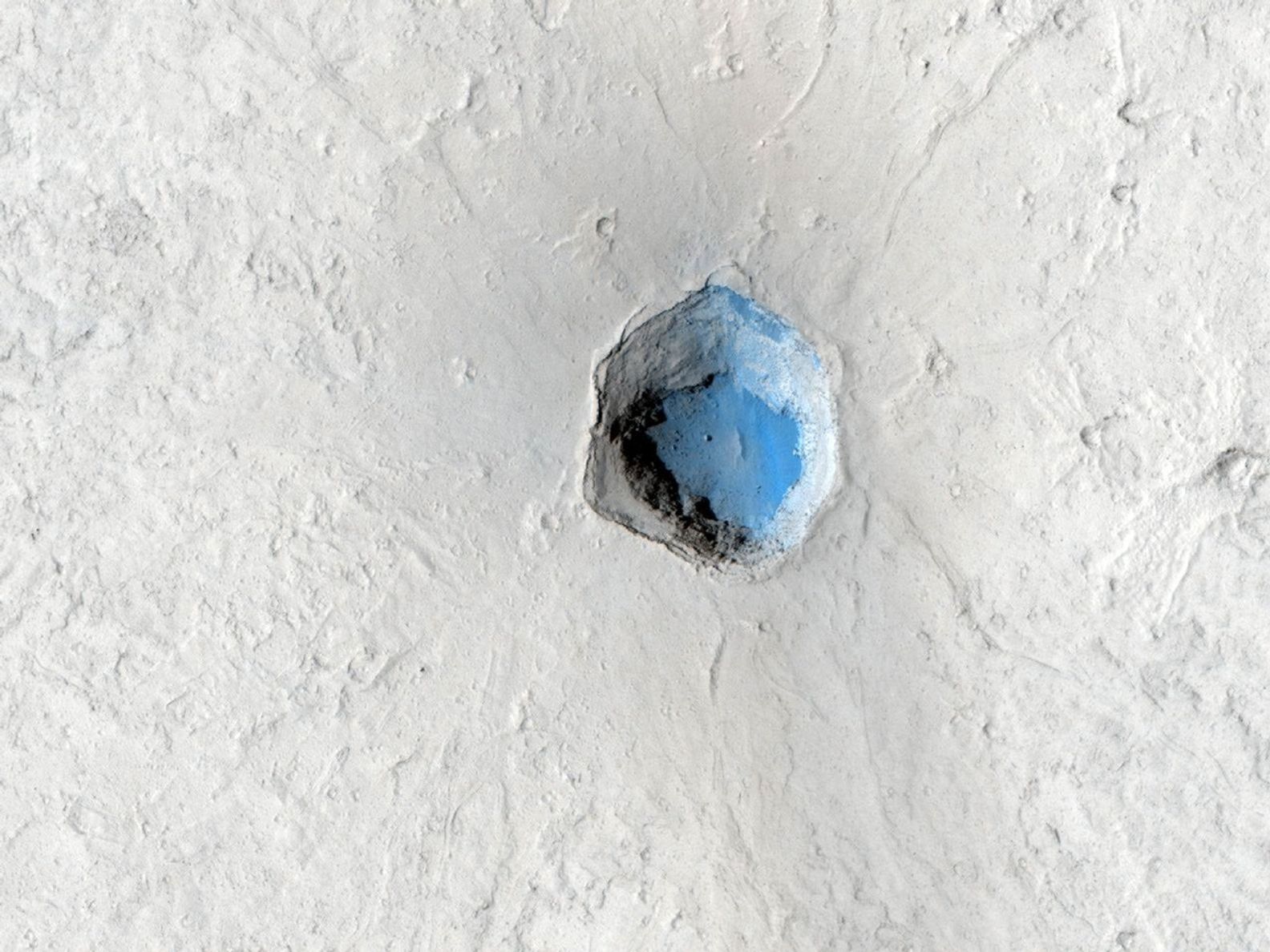 This is a small volcano superimposed on the flanks of a larger one of the Cerberus Tholi.