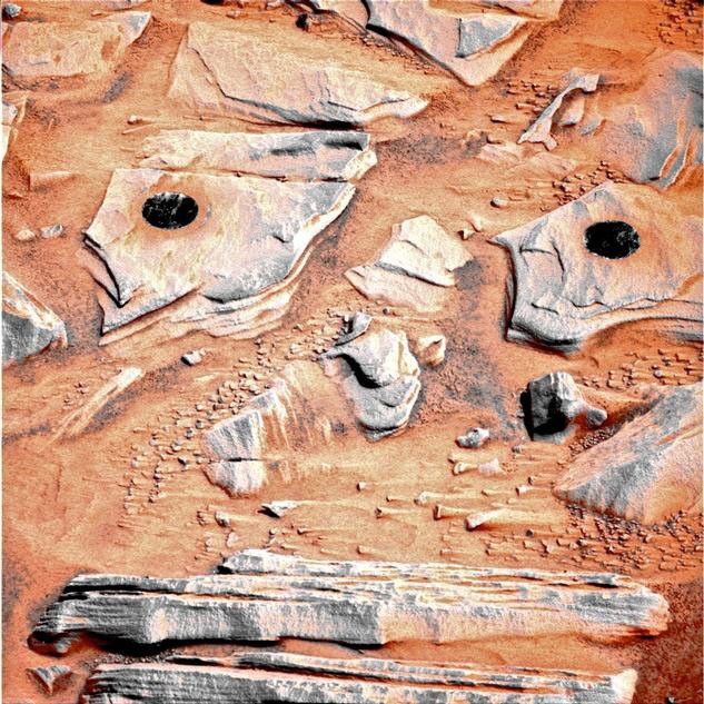 NASA's Mars Exploration Rover Spirit acquired this false-color image on Mars during the rover's 746th Martian day, or sol, after using the rock abrasion tool to brush the surfaces of rock targets informally named "Stars" (left) and "Crawfords" (right).