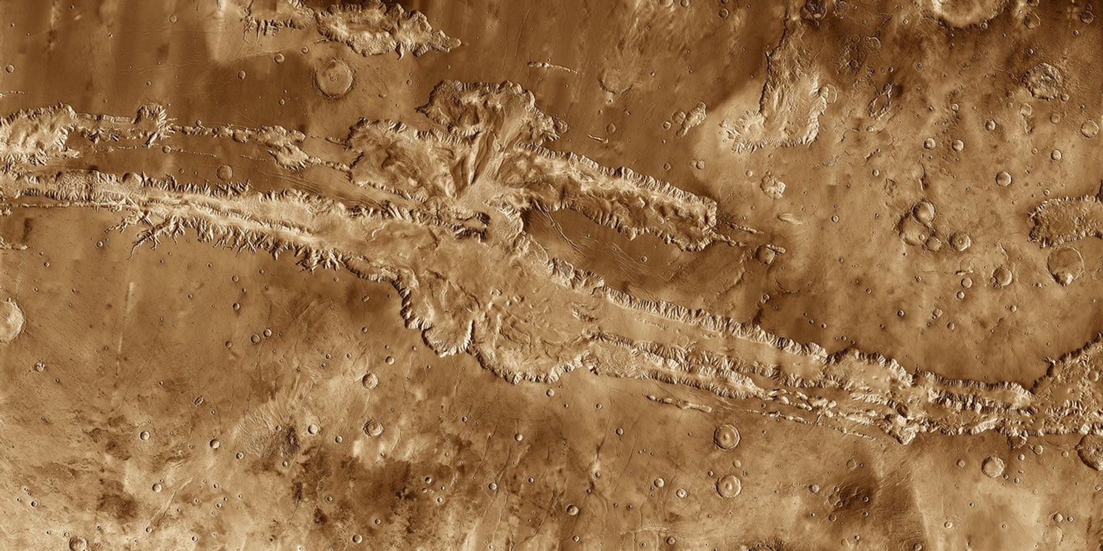This mosaic image of Valles Marineris - colored to resemble the martian surface - comes from the Thermal Emission Imaging System (THEMIS), a visible-light and infrared-sensing camera on NASA's Mars Odyssey orbiter.