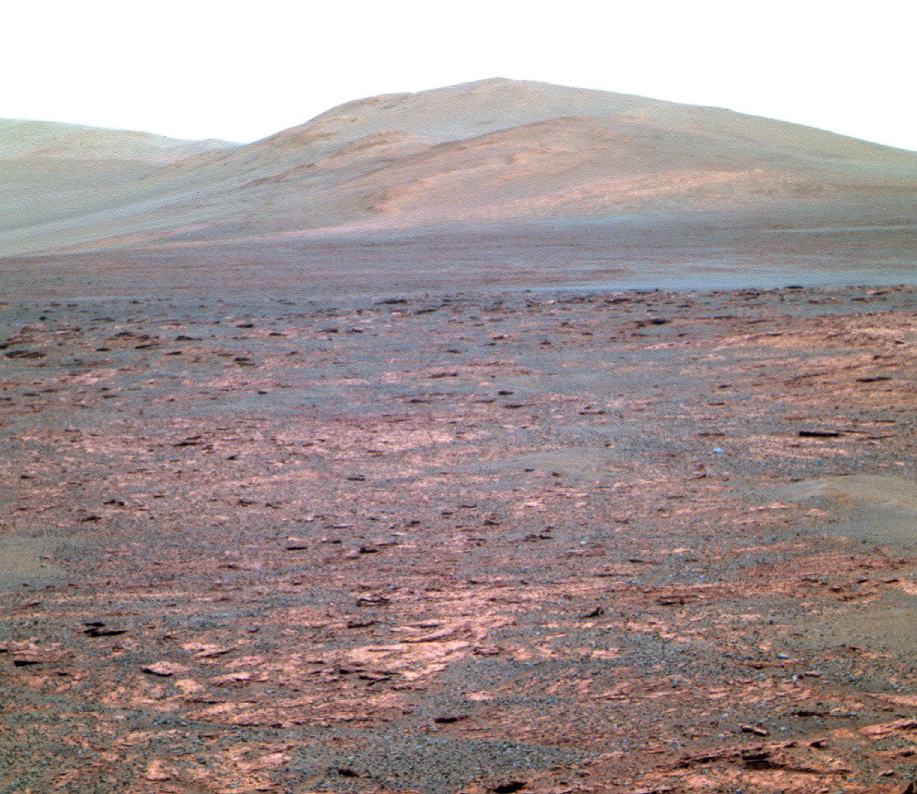 Opportunity used its panoramic camera (Pancam) to acquire this view of "Solander Poin." The southward-looking scene, presented in false color, shows Solander Point on the center horizon, "Botany Bay" in the foreground, and "Cape Tribulation" in the far background at left.