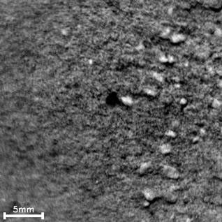 The 16 frames in this time-lapse movie show how repeated laser shots from the Chemistry and Camera (ChemCam) instrument on NASA's Mars rover Curiosity cause a pit to form at the target point in Martian soil.