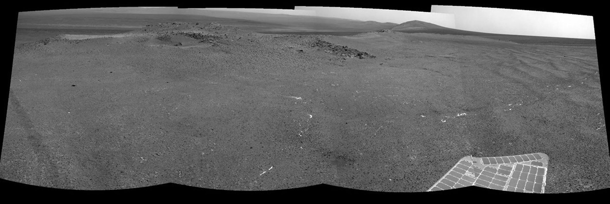 NASA's Mars Exploration Rover Opportunity used its navigation camera to record this view of a rise called "Nobbys Head" during a stop on a multi-week southward drive between two raised segments of the west rim of Endeavour Crater.
