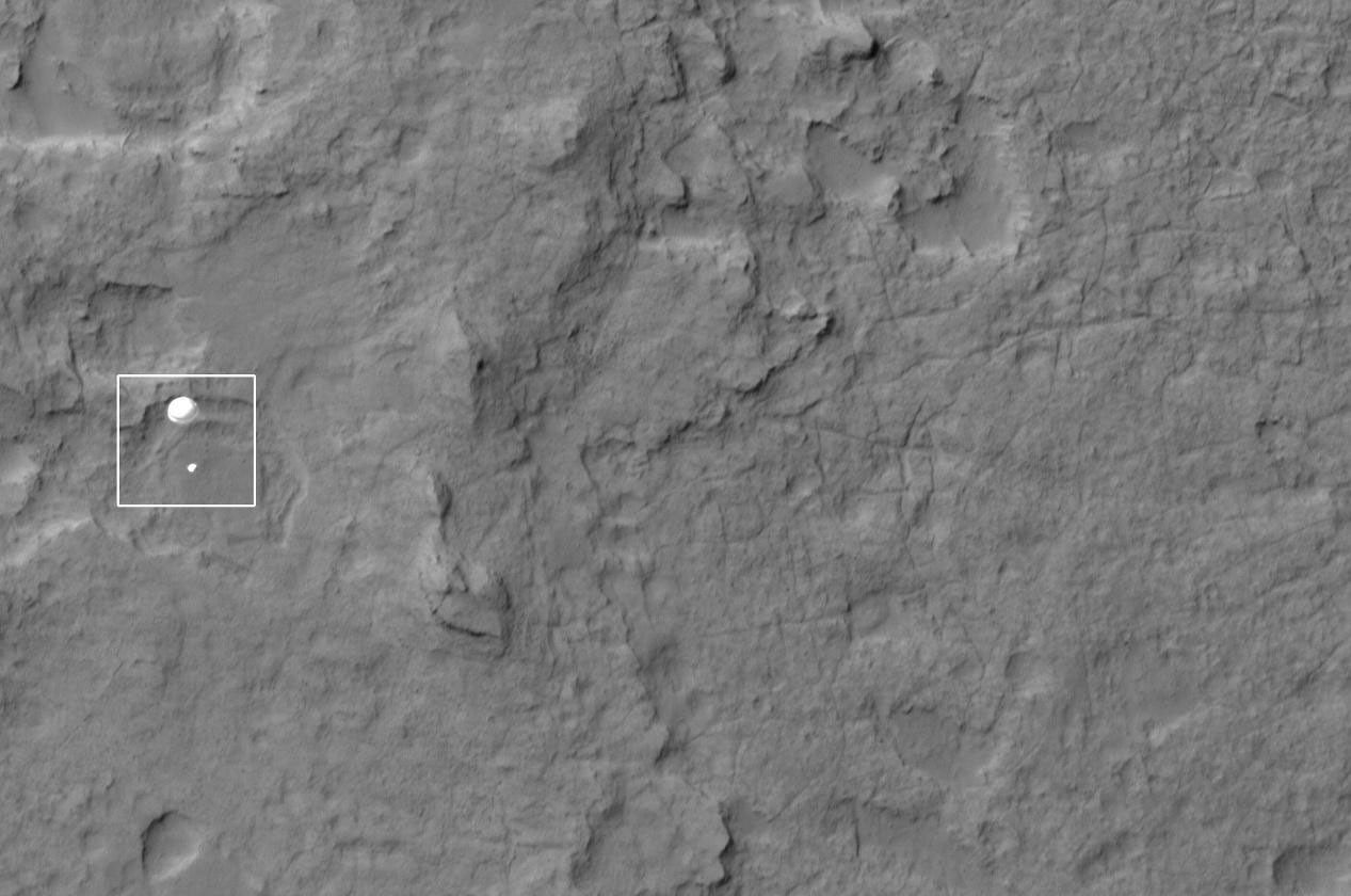 NASA's Curiosity rover and its parachute were spotted by NASA's Mars Reconnaissance Orbiter as Curiosity descended to the surface on Aug. 5 PDT (Aug. 6 EDT).