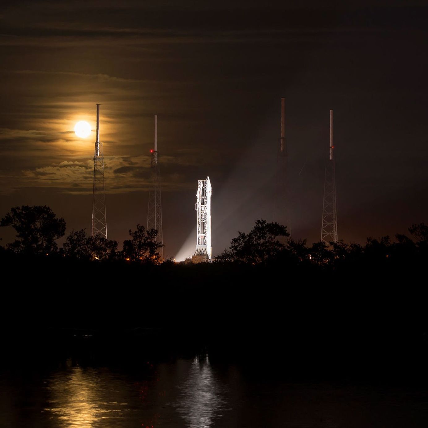 A full moon rises behind the United Launch Alliance Atlas V rocket with NASA's Mars Atmosphere and Volatile EvolutioN (MAVEN) spacecraft onboard at the Cape Canaveral Air Force Station Space Launch Complex 41, Cape Canaveral, Fla. on Nov. 17, 2013.