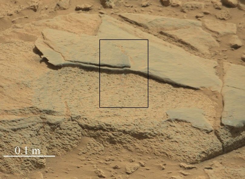The rock "Ithaca" shown here, with a rougher lower texture and smoother texture on top, appears to be a piece of the local sedimentary bedrock protruding from the surrounding soil in Gale Crater.