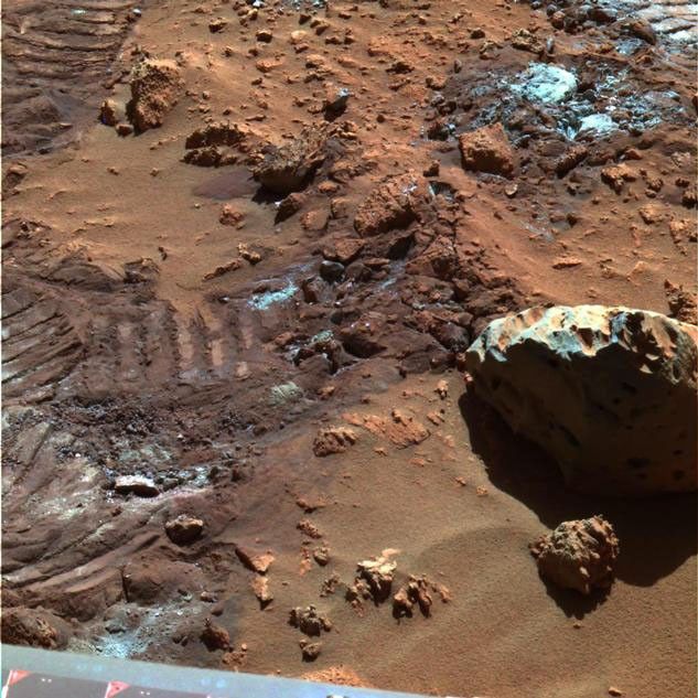 This false-color image highlights mysterious and sparkly dust-like material that is created when the soil in this region is disturbed.