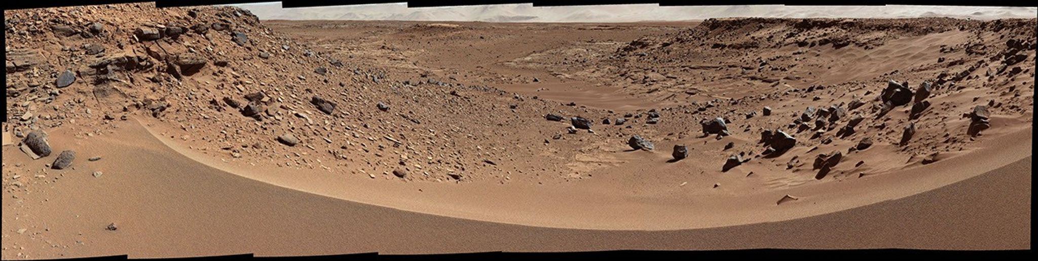 This view combines several frames taken by the Mast Camera (Mastcam) on NASA's Mars rover Curiosity, looking into a valley to the west from the eastern side of a dune at the eastern end of the valley.