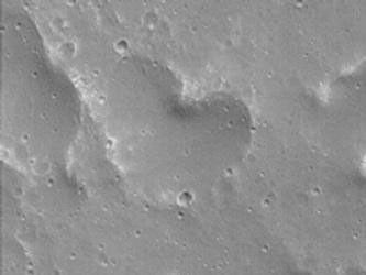 The Mars Global Surveyor (MGS) Mars Orbiter Camera (MOC) took this image in September 2004. The heart in this image is a depression located near 22.7°N, 56.6°W, and is about 378 m (1,240 ft) wide, in an area southeast of Kasei Valles on Mars.
