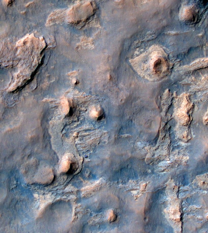 NASA's Curiosity Mars rover and tracks from its driving are visible in this view from orbit, acquired on April 11, 2014, by the High Resolution Imaging Science Experiment (HiRISE) camera on NASA's Mars Reconnaissance Orbiter.