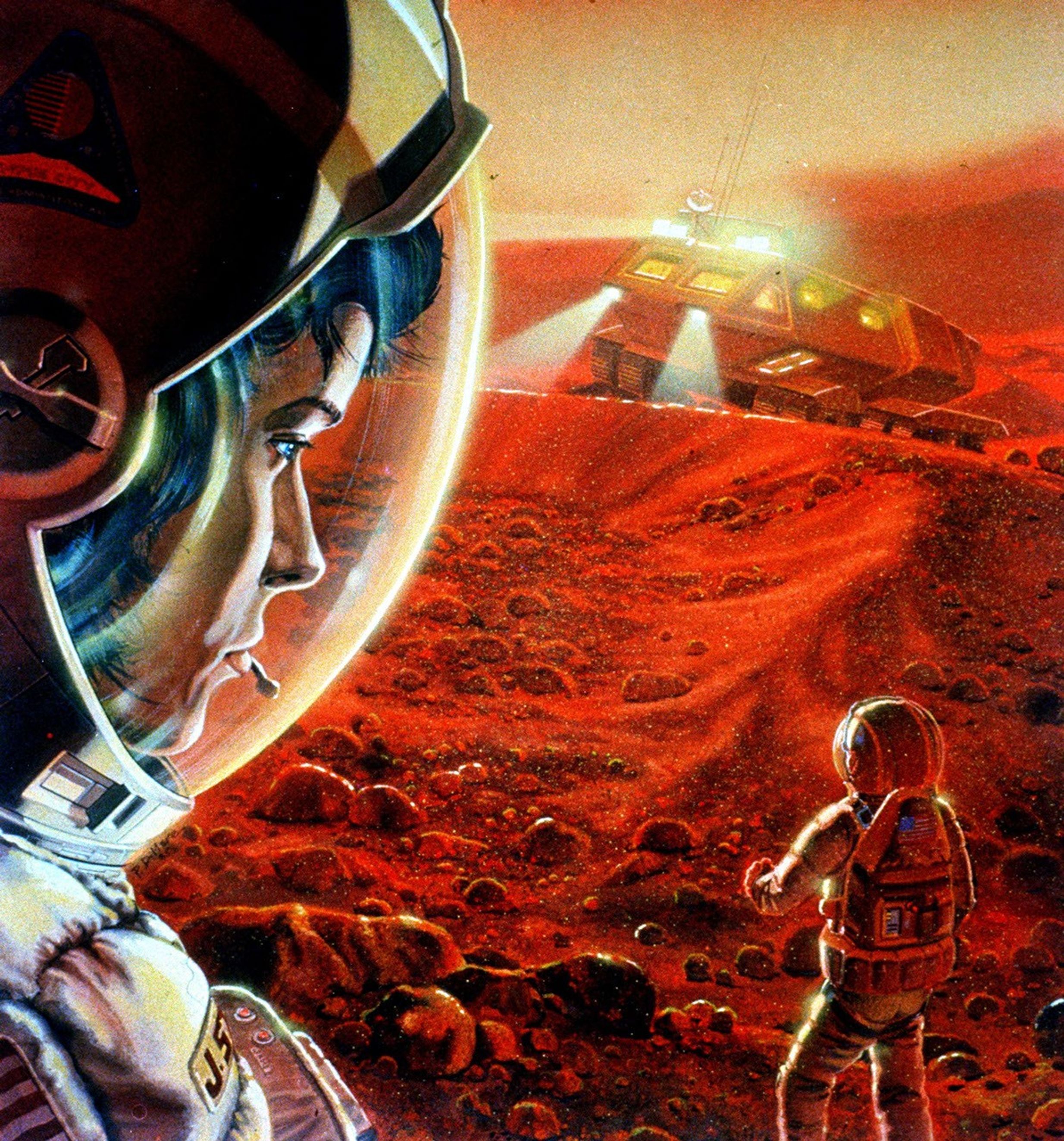 In this artist's concept, an astronaut in the foreground looks back at a fellow astronaut. Behind them both is a vehicle with its headlights beaming.