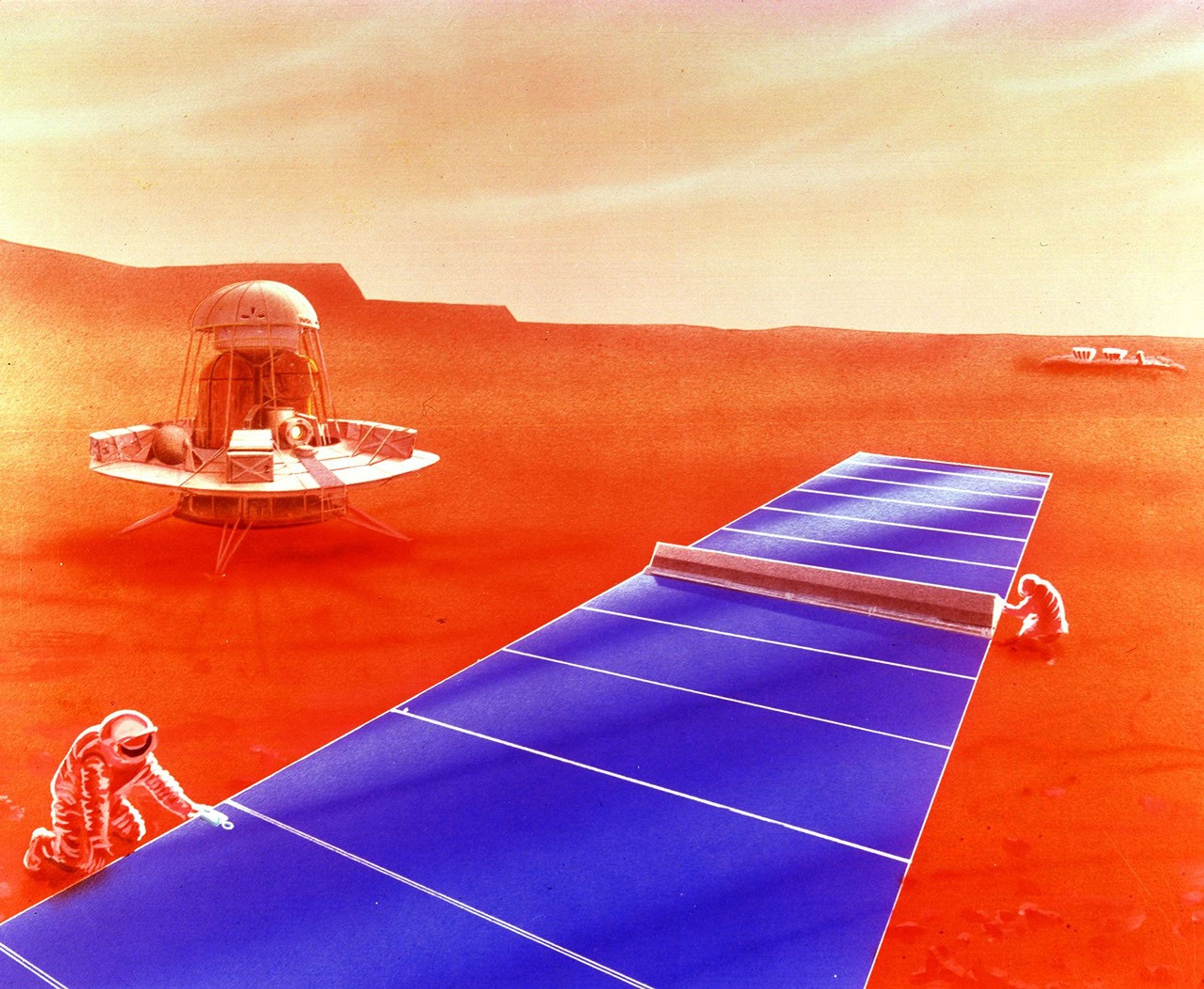 Solar panels stretch out in a large blue line on the reddish Martian surface as astronauts work on it.