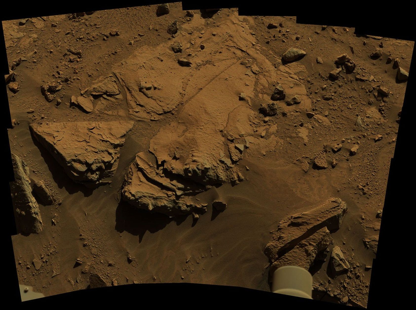 NASA's Curiosity Mars rover has driven within robotic-arm's reach of the sandstone slab at the center of this April 23 view from the rover's Mast Camera.