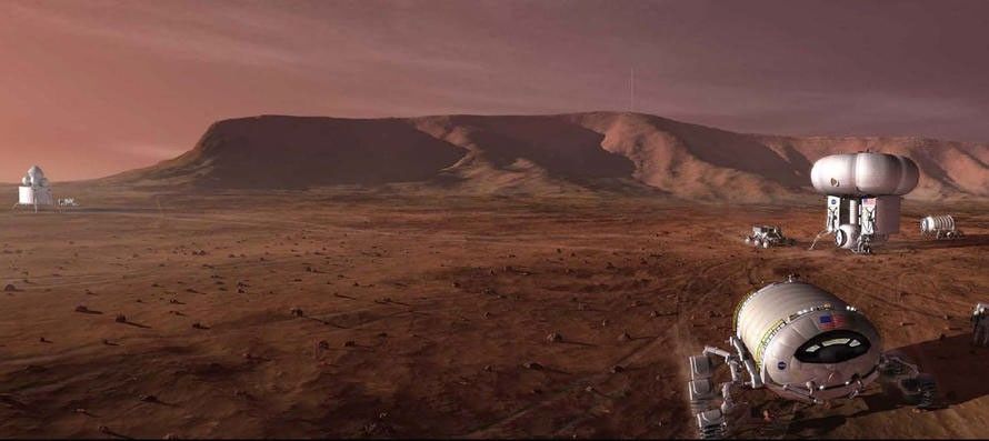 This artist's concept shows a Mars outpost with vehicles astronauts would use to get around.