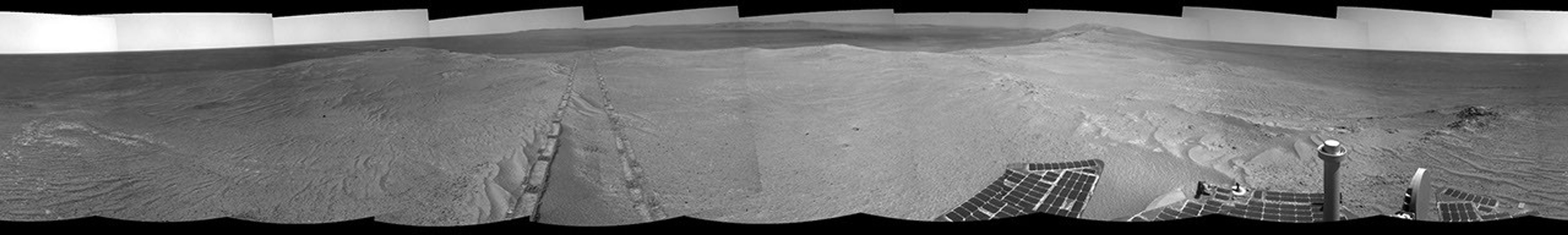 The component images for this 360-degree panorama were taken by the navigation camera on NASA's Mars Exploration Rover Opportunity after the rover drove about 97 feet southeastward on April 22, 2014. The location is on the western rim of Endeavour Crater. The two parallel tracks are 3.3 feet apart.