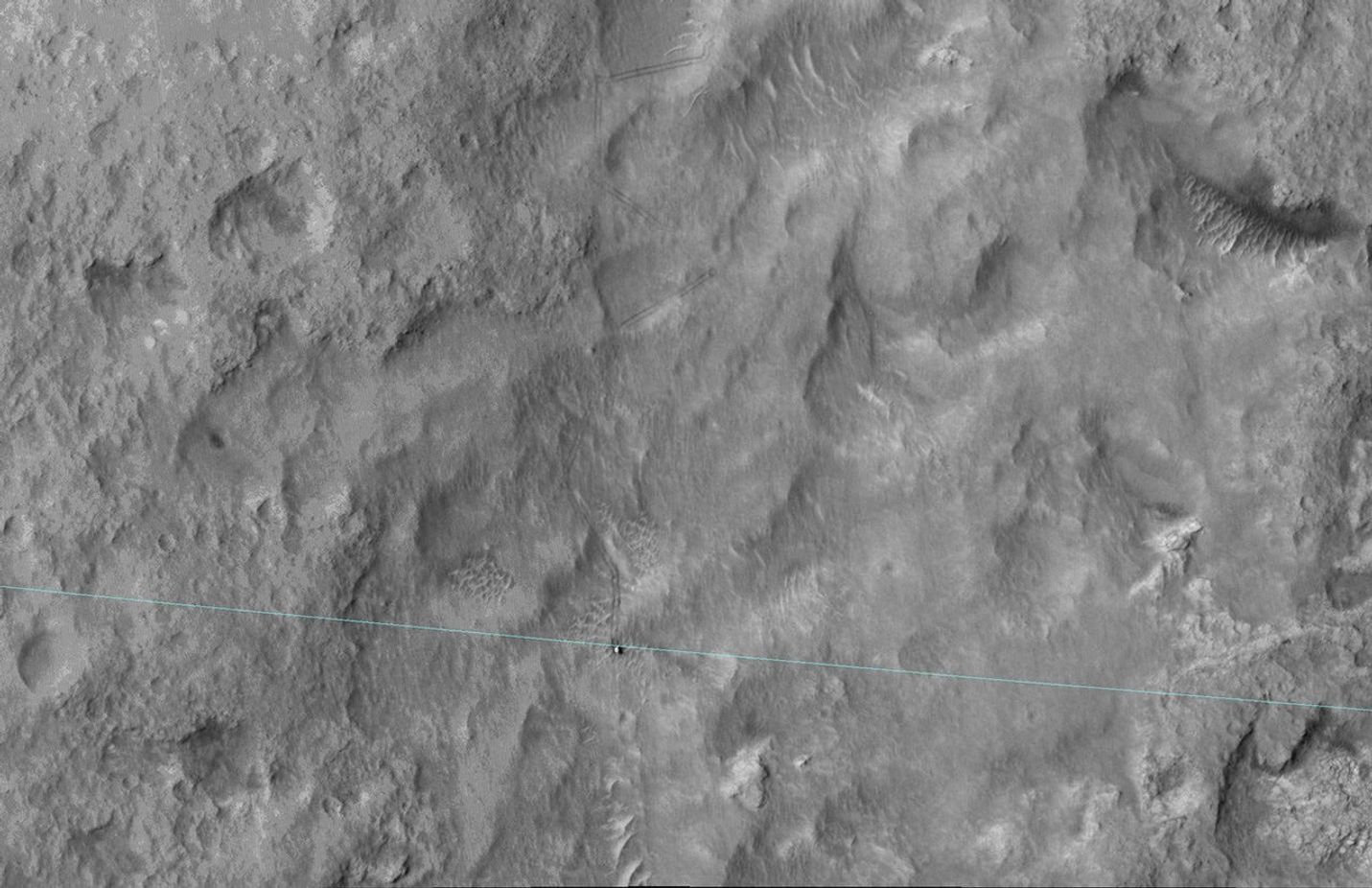 Curiosity-msl-landing-ellipse-edge-HiRise-This image shows Curiosity's landing area, rover tracks and a light blue line crosses showing the rover passing the landing-ellipse boundary.