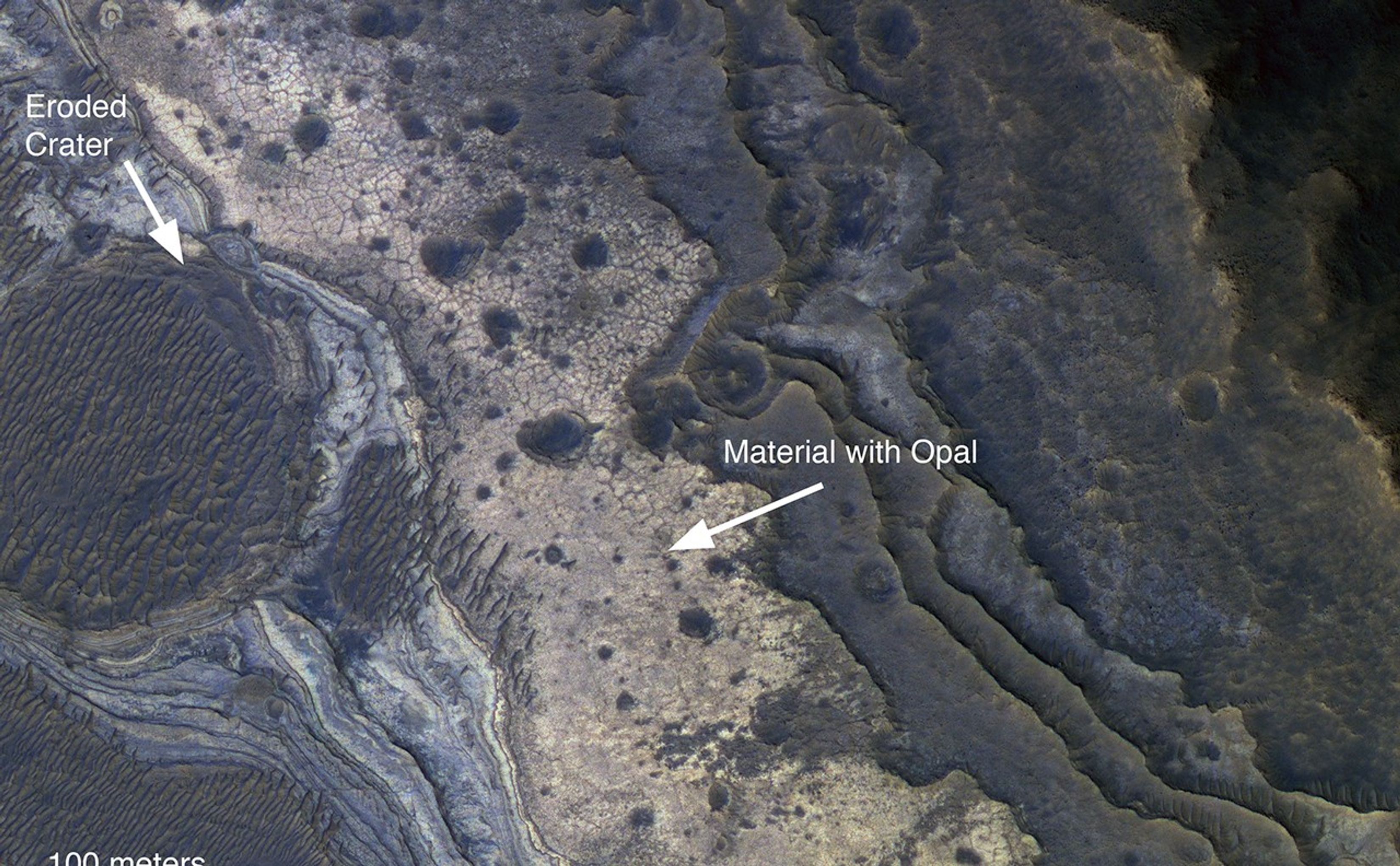 NASA's Mars Reconnaissance Orbiter has revealed Martian rocks containing a hydrated mineral similar to opal. The rocks are light-toned and appear cream-colored in this false-color image taken by the High Resolution Imaging Science Experiment camera. Images acquired by the orbiter reveal that different layers of rock have different properties and chemistry. The opal minerals are located in distinct beds of rock outside of the large Valles Marineris canyon system and are also found in rocks within the canyon. The presence of opal in these relatively young rocks tells scientists that water, possibly as rivers and small ponds, interacted with the surface as recently as two billion years ago, one billion years later than scientists had expected. The discovery of this new category of minerals spread across large regions of Mars suggests that liquid water played an important role in shaping the planet's surface and possibly hosting life.