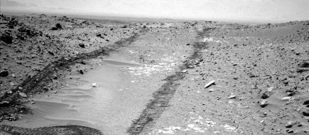 In this image from NASA's Curiosity Mars rover looking up the ramp at the northeastern end of "Hidden Valley," a pale outcrop including drilling target "Bonanza King" is at the center of the scene.