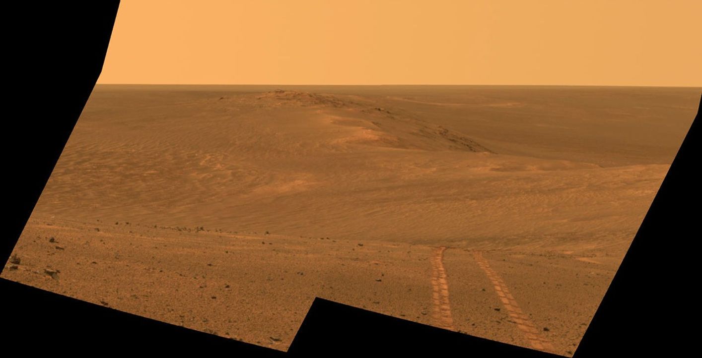 This scene from the Pancam on NASA's Mars Exploration Rover Opportunity looks back toward part of the west rim of Endeavour Crater that the rover drove along, heading southward, during the summer of 2014. It combines exposures taken on Aug. 15, 2014, and is presented in approximate true color.