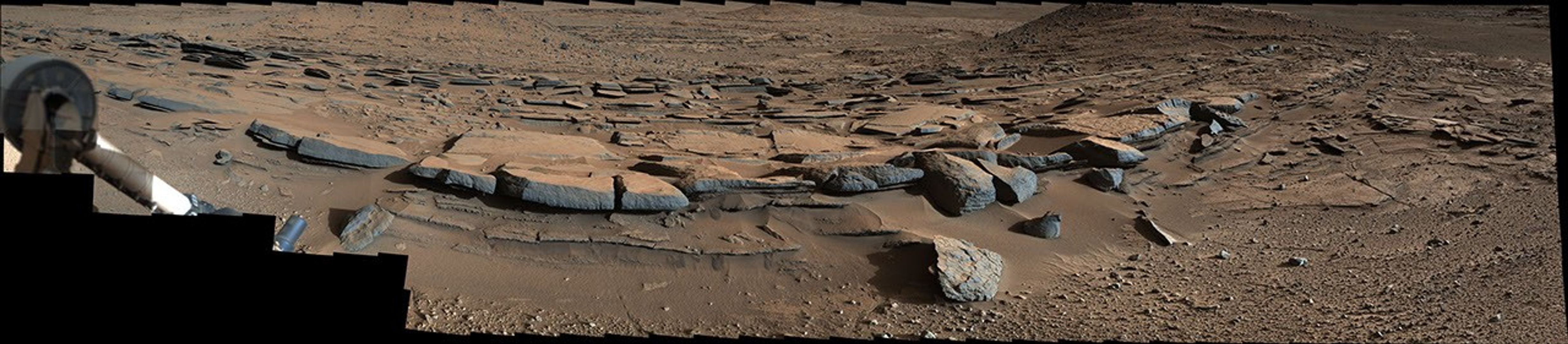 This March 25, 2014, view from the Mastcam on NASA's Curiosity Mars rover looks southward at the Kimberley waypoint. In the foreground, multiple sandstone beds show systematic inclination to the south suggesting progressive build-out of delta sediments in that direction (toward Mount Sharp).