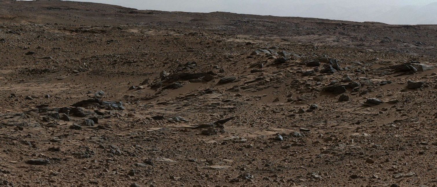 This image shows inclined beds characteristic of delta deposits where a stream entered a lake, but at a higher elevation and farther south than other delta deposits north of Mount Sharp. This suggests multiple episodes of delta growth building southward. It is from Curiosity's Mastcam.