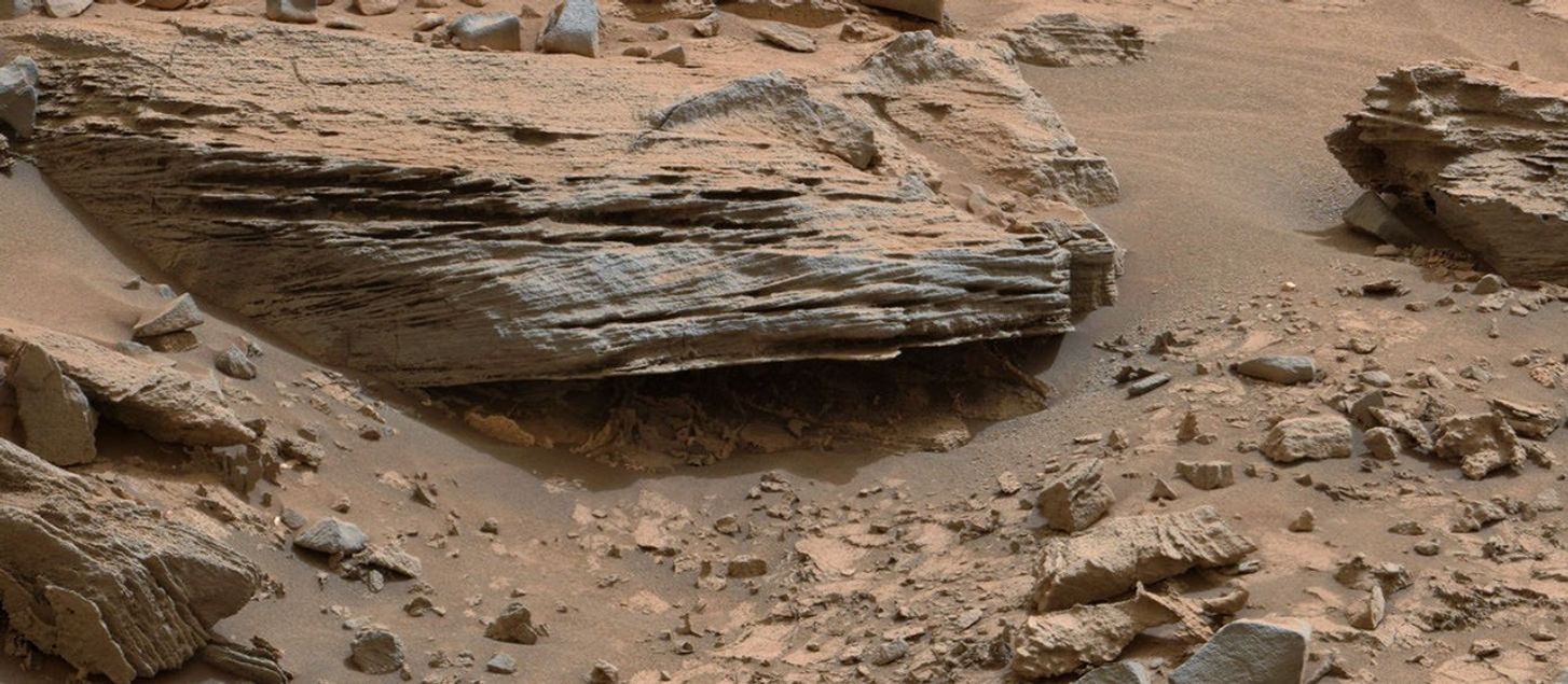 Cross-bedding seen in the layers of this Martian rock is evidence of movement of water recorded by the waves or ripples of loose sediment the water passed over, such as a current in a lake. This image was acquired by the Mastcam on NASA's Curiosity Mars rover on Nov. 2, 2014.