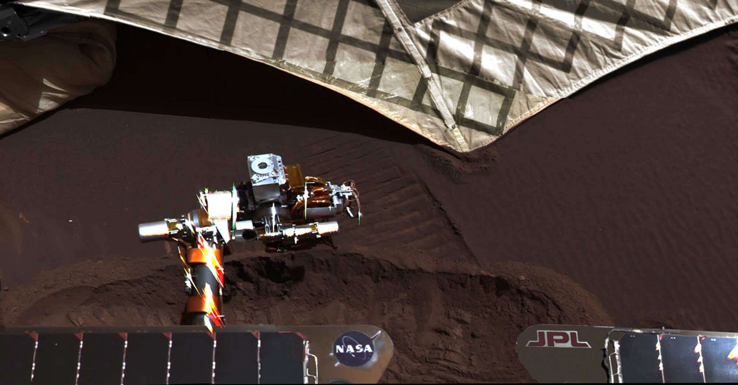 On March 20, 2004, NASA's Mars Exploration Rover Opportunity used a wheel to dig a trench revealing subsurface material beside the lander hardware that carried the rover to the surface of Mars 55 Martian days, or sols, earlier.