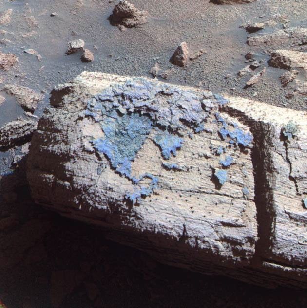 This image from the panoramic camera on NASA's Mars Exploration Rover Opportunity shows a rock called "Chocolate Hills," which the rover found and examined at the edge of a young crater called "Concepción."