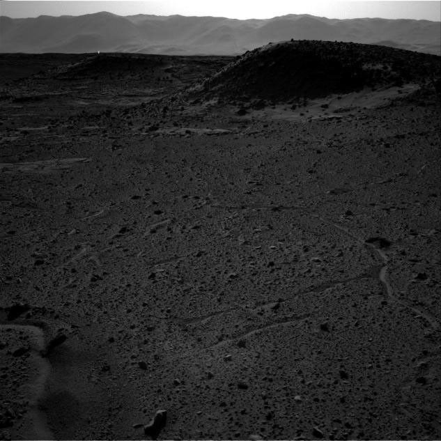 This image from NASA's Curiosity Mars rover, taken on April 3, 2014, includes a bright spot near the upper left corner. Possible explanations include  a glint from a rock or a cosmic-ray hit.