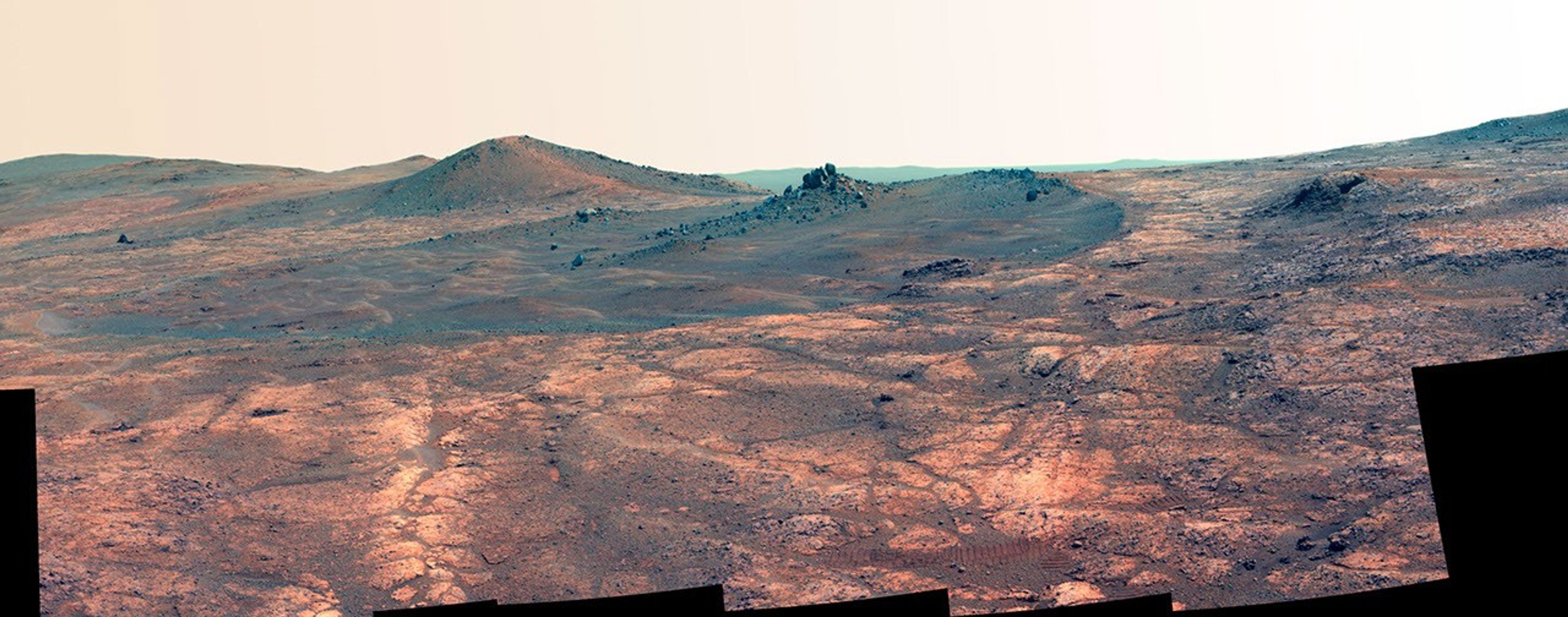 
			Rock Spire in 'Spirit of St. Louis Crater' on Mars (False Color) - NASA Science			