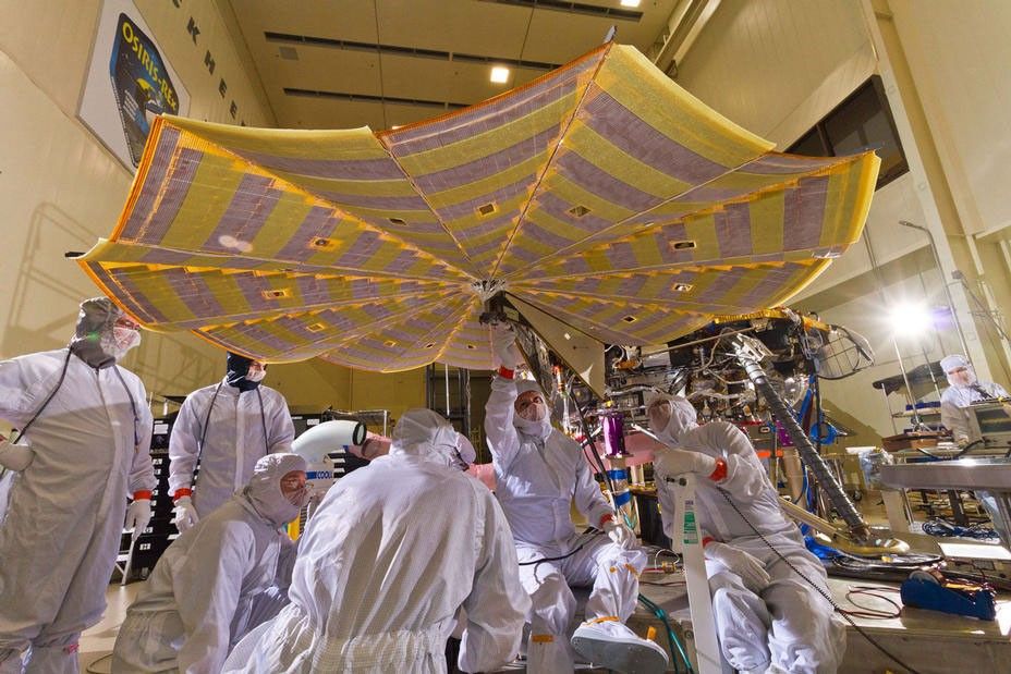 Engineers and technicians at Lockheed Martin Space Systems, Denver, run a test of deploying the solar arrays on NASA's InSight lander in this April 30, 2015 image.