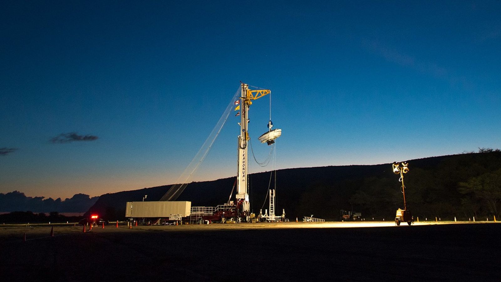 NASA's Low-Density Supersonic Decelerator hangs from a launch tower at U.S. Navy's Pacific Missile Range Facility in Kauai, Hawaii.