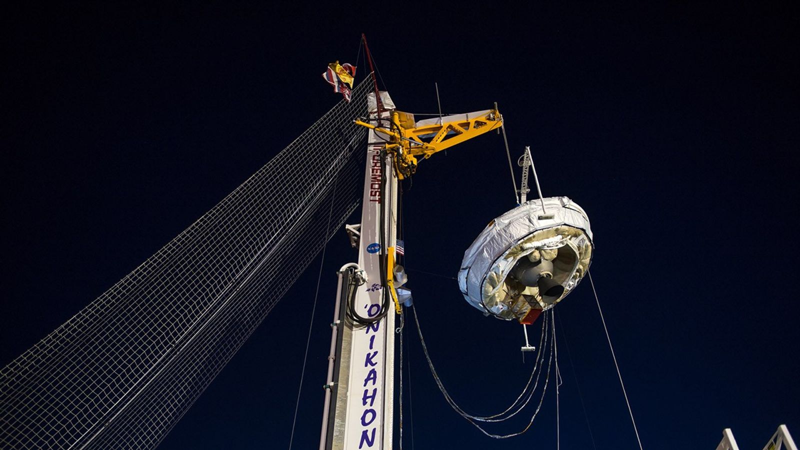 NASA's Low-Density Supersonic Decelerator hangs from a launch tower at U.S. Navy's Pacific Missile Range Facility in Kauai, Hawaii.