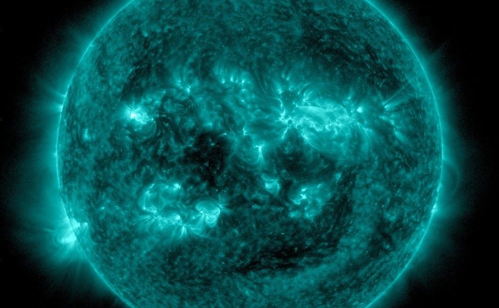 An eruption from the surface of the sun is conspicuous in the lower left portion of this July 6, 2015, image from NASA's Earth-orbiting Solar Dynamics Observatory. It originates from a location on the surface where NASA's Curiosity Mars rover had been tracking a sunspot in late June and early July.