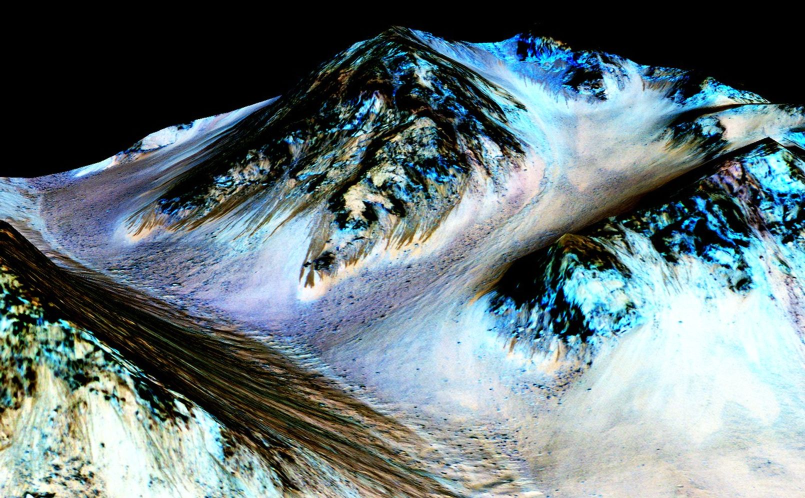 Dark, narrow streaks on Martian slopes such as these at Hale Crater are inferred to have been formed by seasonal flow of water on contemporary Mars. Detection of hydrated salts at the streaks supports that interpretation. The features are called "recurring slope lineae."